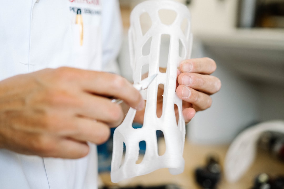 gallery-5 Custom made orthoses printed on a 3D printer being corrected by a orthopedist